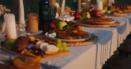 Close-up of the dishes standing on the festive table outdoor