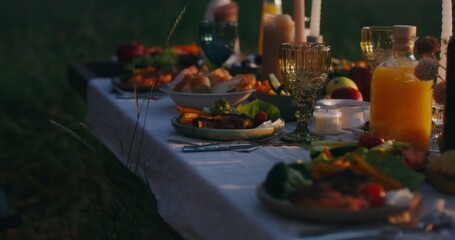 Close-up of the dishes standing on the festive table outdoor
