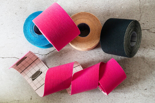 Colorful kinesiology taping offers elastic support to reduce muscle aches, tension, and pain.