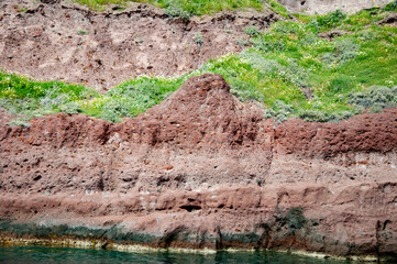 Tourism and travel destination, Greece. Geology. Volcanic rock nature. Rock formation with erosion. Landscape with rock formation. Nature formation. Geological rock formation. Volcanic cliffs