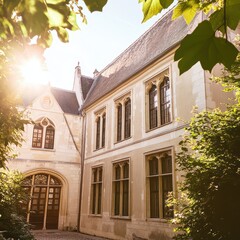 Fototapeta premium Sunlit historic building amidst greenery