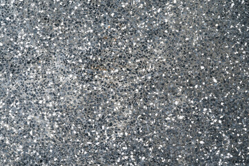 black dark background with texture interspersed with white paving stones