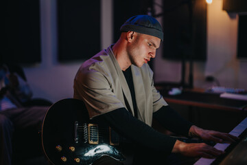 A dedicated musician concentrates deeply while playing piano in a warmly lit studio environment, creating a serene and focused atmosphere. The scene highlights musical passion and creative artistry.