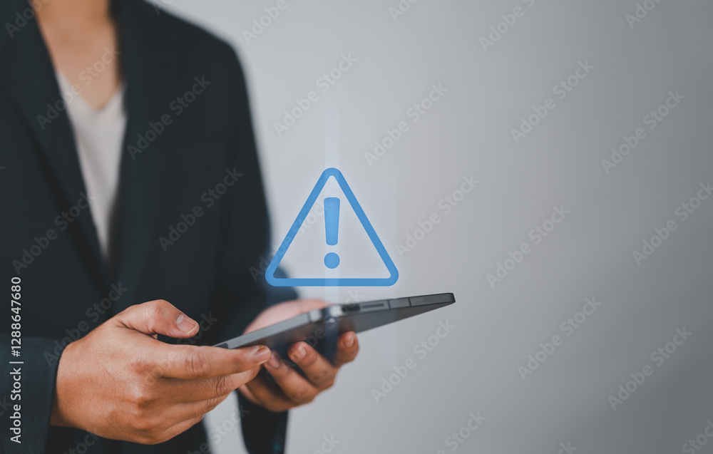 Poster System warning hacked alert, cyber attack on computer network.Businessman using tablet with warning sign notification error, Malicious software,virus and cybercrime, Cybersecurity,data breach.