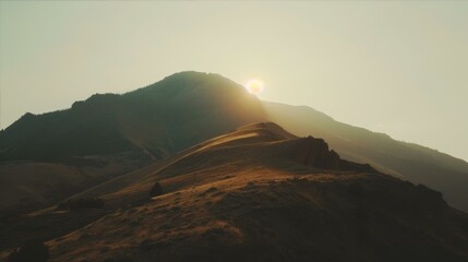 Obraz premium Hilly Terrain at Sunset View Featuring Atmospheric Mountain Ridges under Golden Sky Conditions