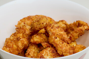 chicken croquettes in a bowl on a table