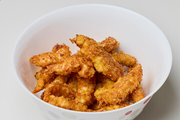 chicken croquettes in a bowl on a table