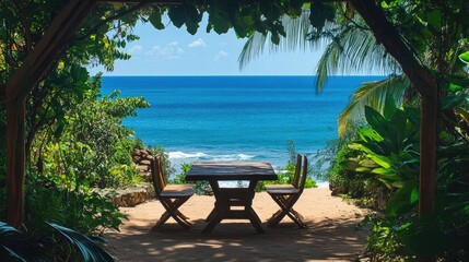 Obraz premium Relaxing beachside view with a rustic wooden table nestled under lush tropical plants, facing the deep blue sea