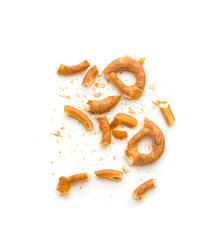 crumbs from german pretzels on white background