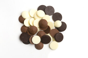 chocolate drops on white background