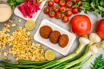 felafel dishes traditional Lebanese and Middle Eastern cuisine food in a top-down view with vegetable ingredients 