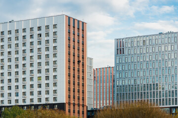 Modern residential buildings in the city under the blue sky on a clear day. Buying real estate with a mortgage. Construction industry. High quality photo