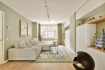 A stylish modern living room featuring a comfortable sectional sofa, large window, elegant rug, and decorative shelves that enhance the welcoming atmosphere.