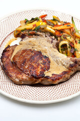 Meat dish and sauce on a plate