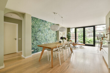 Modern dining area with green wall feature