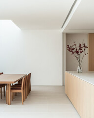 Fototapeta premium Modern minimalist dining area with wooden furniture and natural light