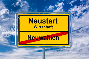 Vor einem blauen Himmel steht ein Ortsschild mit der Aufschrift Neuwahlen und Neustart Wirtschaft -...