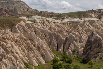 Cappadocia’s colorful rock formations, shaped by wind and water erosion, create a surreal landscape. Layers of volcanic rock reveal history, while valleys and cliffs form an awe-inspiring natural wond