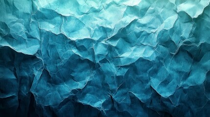Obraz premium This image depicts a textured crumpled paper gradient in shades of blue