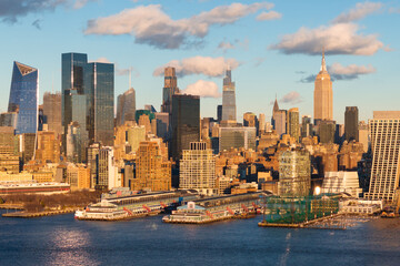 Fototapeta premium Aerial view of New York City skyline with Hudson River Park and Manhattan skyscrapers. The urban landscape includes Midtown high-rise buildings and Chelsea Piers
