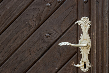Detail of handle on the church door, Kajov, Czechia