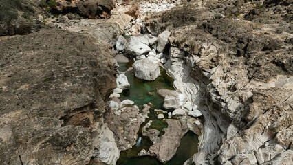 Exploring the unique rock formations and clear waters of Kalysan Canyon in Socotra Island