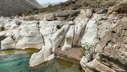 Discover Kalysan Canyons unique rock formations and clear waters in daylight