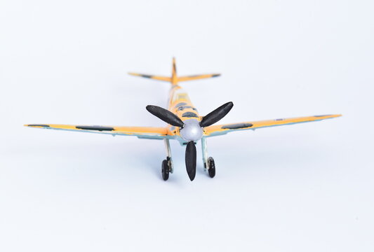 Plastic toy, completed and painted model for gluing. Historical German plane Messerschmitt BF109 E.