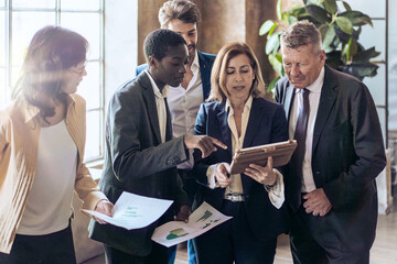 Diverse business professionals discussing strategy during office meeting