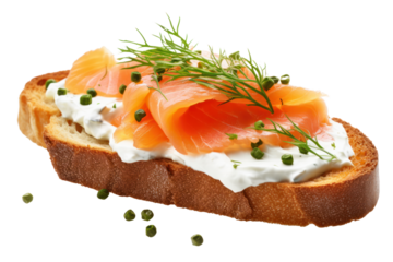 Appetizing smoked salmon on toasted bread with garnished with chives and pepper isolated on white background