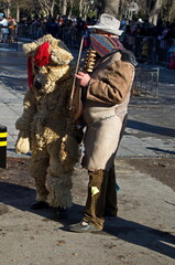 Volunteer mummers, pantomime artists of nature games, roam the town in a traditional exorcism, Sofia, Bulgaria 