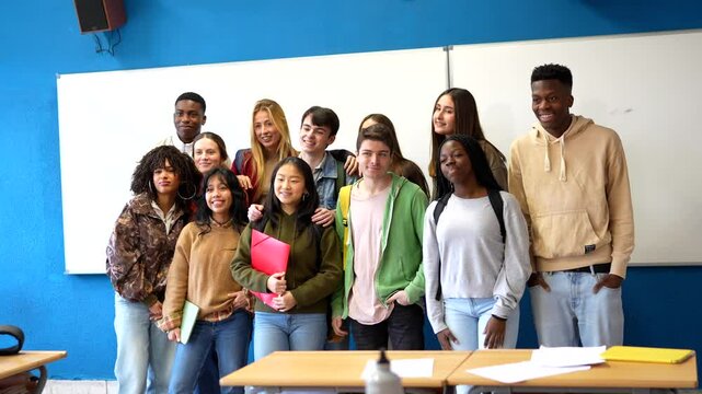 Multiethnic students posing together in classroom