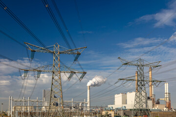 Electricity transmission towers in front of a Dutch power station in Zeeland, The Netherlands