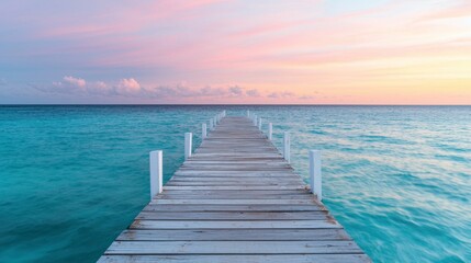 Obraz premium Serene Wooden Pier Extending Into Calm Ocean Under Colorful Sky