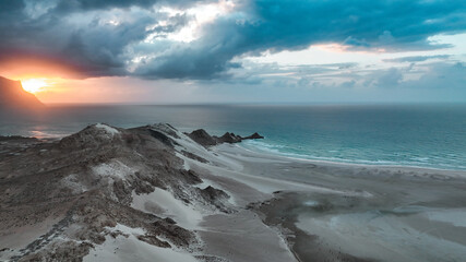Discover unique Socotra landscape at sunset featuring dramatic cliffs and serene waters