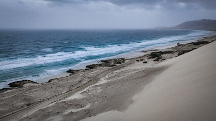 Stunning coastal landscape of Socotra Island with shifting sands and waves crashing