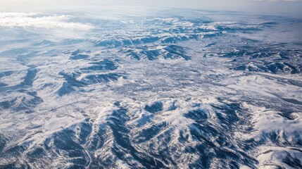 Fototapeta premium An aerial view of a snow covered landscape 