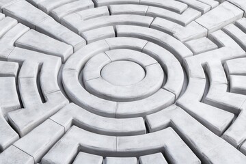 A gray concrete maze design featuring concentric circles and pathways, creating an intricate pattern for exploration or contemplation.
