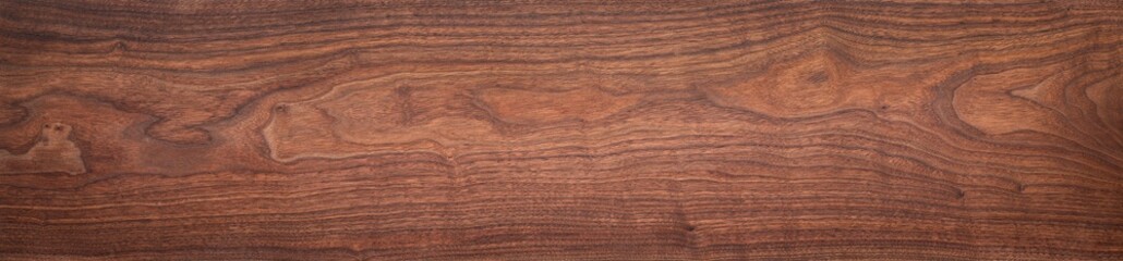 Walnut wood texture. Extra long walnut wood plank natural texture background. Long wood plank texture.