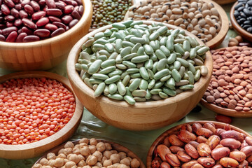 Various legumes in wooden bowls. Organic pulses. Healthy plant-based diet, vegan food