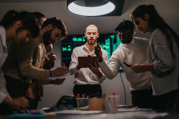 A productive meeting of a diverse team discussing strategies and plans in a modern workspace, focusing on collaboration and innovation, promoting teamwork and professional growth, and achieving