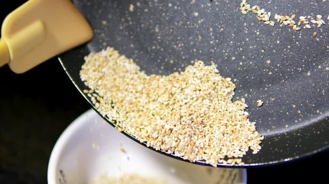 sesame seeds in small glass bowl, closeup, 4k, parallax shot.