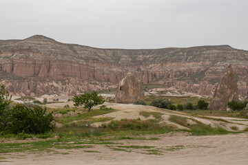 Cappadocia’s colorful rock formations, shaped by wind and water erosion, create a surreal landscape. Layers of volcanic rock reveal history, while valleys and cliffs form an awe-inspiring natural wond
