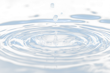 Water droplet impact, creating concentric ripples.