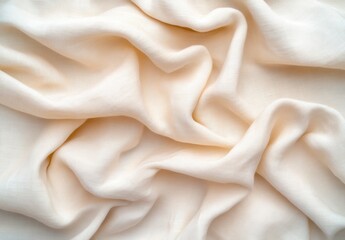 Fototapeta premium Cream colored textured fabric with soft, flowing drapes. The image shows a close up view of the material's texture and folds