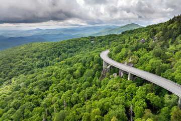Car road trip on Blue Ridge Parkway in North Carolina. Linn Cove Viaduct in Appalachian mountains...