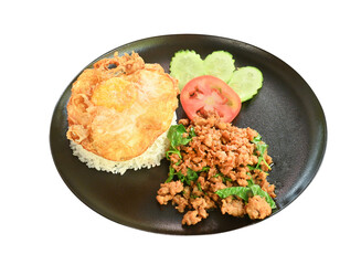 Stir fried Thai basil with minced pork and a fried egg on black plate  on  transparent.