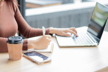 Fototapeta premium Beautiful asian woman listen to music with headphone in coffee shop