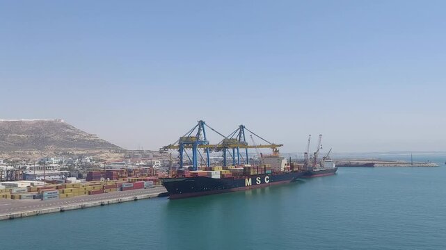 Moroco Agadir apr 24 2024 Large Cargo Ship Docked at Busy Port with Cranes