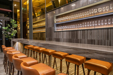 Empty Wine Glasses Displayed on Shelf in Bar